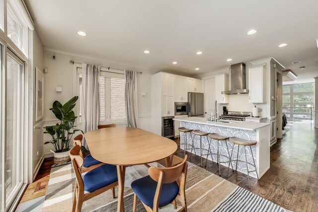 2423 W Erie St, Chicago, IL 60612 - dining room with dark wood-type flooring, wine cooler, and recessed lighting