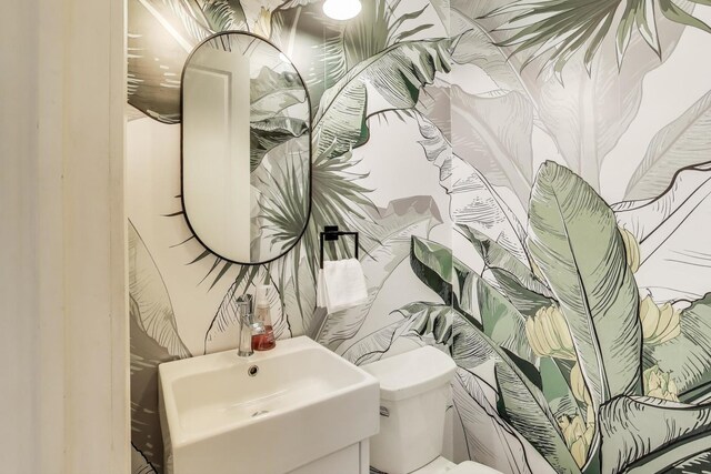 2423 W Erie St, Chicago, IL 60612 - bathroom featuring toilet and a sink