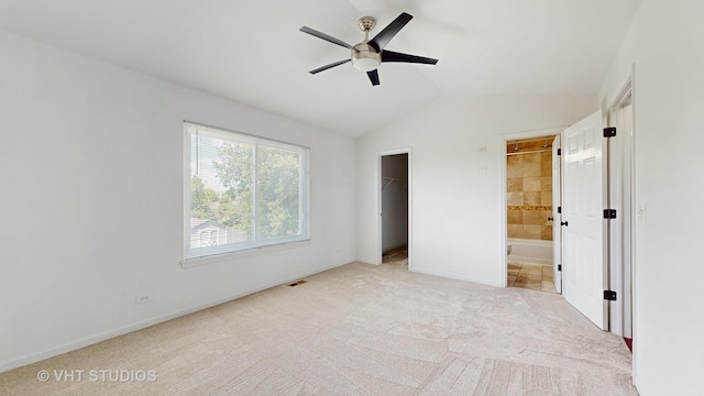 228 Dunton Ct, Mundelein, IL 60060 - unfurnished bedroom featuring lofted ceiling, a spacious closet, light colored carpet, ensuite bathroom, and a closet