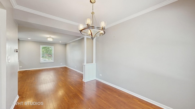 228 Dunton Ct, Mundelein, IL 60060 - unfurnished room with crown molding, wood-type flooring, and a chandelier