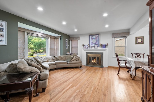 2837 W Coyle Ave, Chicago, IL 60645 - living area with light wood-style flooring, recessed lighting, and a glass covered fireplace