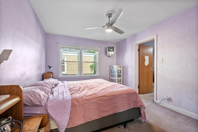 2837 W Coyle Ave, Chicago, IL 60645 - bedroom featuring light colored carpet, a wall unit AC, and ceiling fan