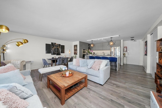 330 W Diversey Pkwy Unit 1606, Chicago, IL 60657 - living room featuring light wood-style flooring and baseboards