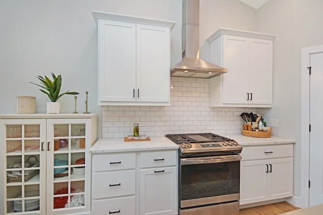 1723 Glenbridge Rd, Bloomington, IL 61704 - kitchen featuring gas range, wall chimney exhaust hood, backsplash, and light stone counters