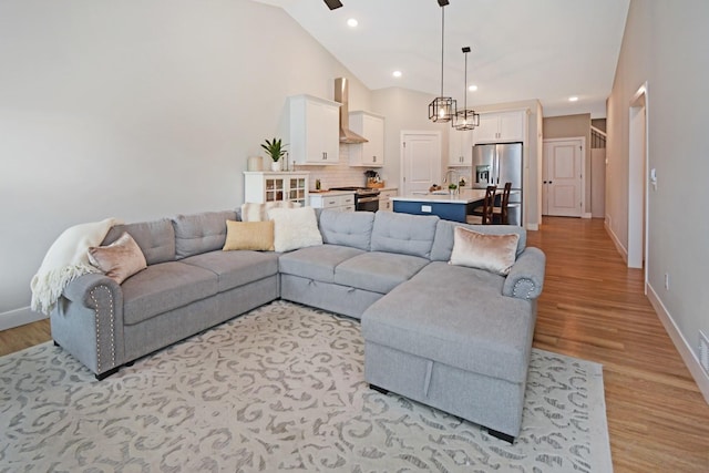 1723 Glenbridge Rd, Bloomington, IL 61704 - living room with light wood-style floors, recessed lighting, vaulted ceiling, and ceiling fan