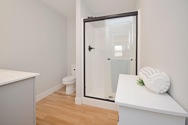 1723 Glenbridge Rd, Bloomington, IL 61704 - full bathroom featuring vanity, wood finished floors, and a stall shower