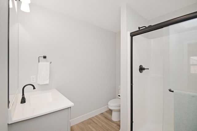 1723 Glenbridge Rd, Bloomington, IL 61704 - full bathroom featuring wood finished floors, a shower stall, and vanity