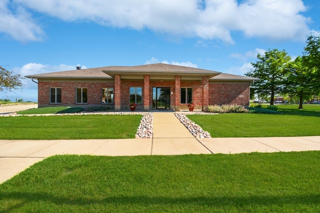 1723 Glenbridge Rd, Bloomington, IL 61704 - prairie-style home featuring a front lawn, brick siding, and roof with shingles
