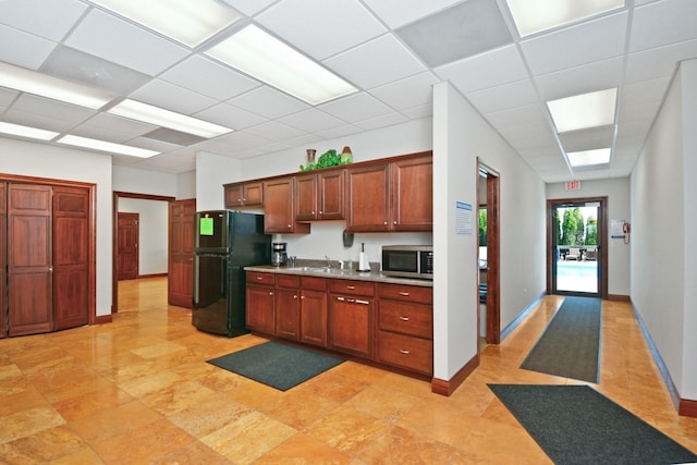 1723 Glenbridge Rd, Bloomington, IL 61704 - kitchen with freestanding refrigerator, stainless steel microwave, a drop ceiling, and light countertops
