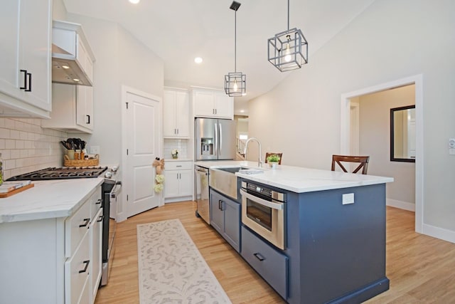 1723 Glenbridge Rd, Bloomington, IL 61704 - kitchen with appliances with stainless steel finishes, white cabinets, light wood finished floors, backsplash, and recessed lighting