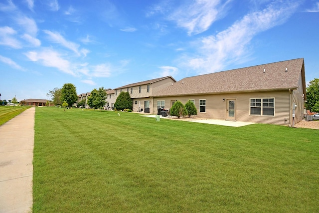1723 Glenbridge Rd, Bloomington, IL 61704 - view of grassy yard featuring a patio area