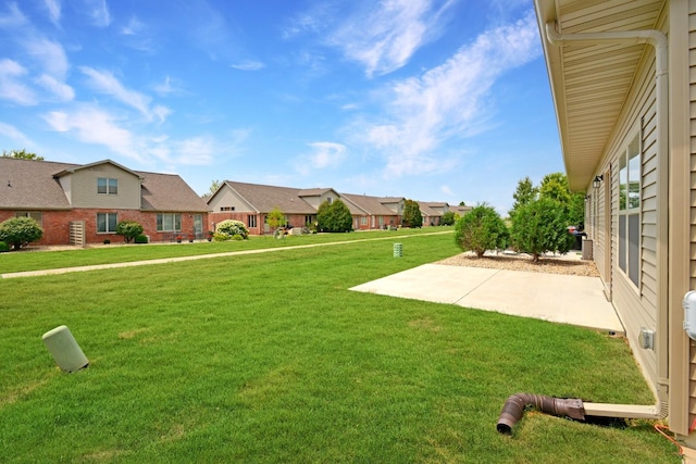 1723 Glenbridge Rd, Bloomington, IL 61704 - view of green lawn with a residential view and a patio