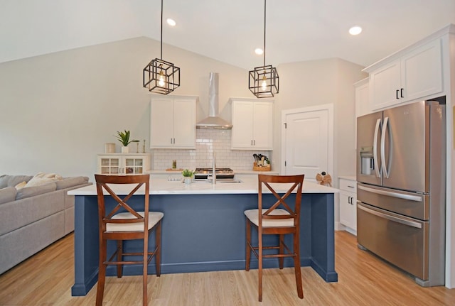 1723 Glenbridge Rd, Bloomington, IL 61704 - kitchen with stainless steel fridge with ice dispenser, wall chimney range hood, white cabinets, light countertops, and recessed lighting