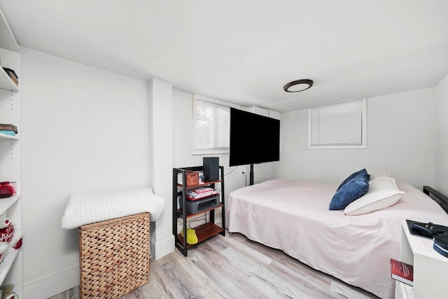 5044 W Roscoe St, Chicago, IL 60641 - bedroom featuring light wood finished floors and baseboards