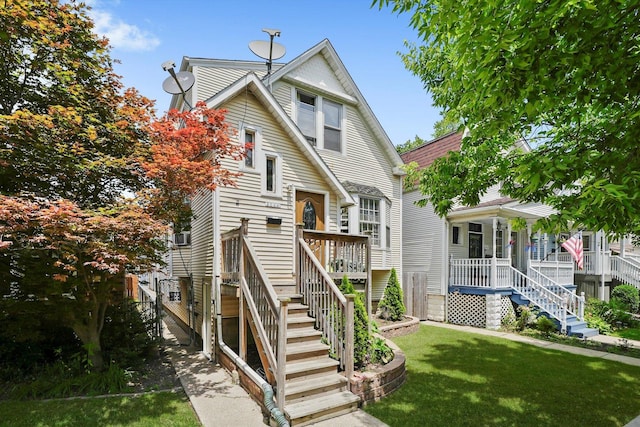 5044 W Roscoe St, Chicago, IL 60641 - view of front of house with stairs and a front lawn