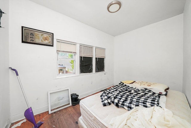 5044 W Roscoe St, Chicago, IL 60641 - bedroom with baseboards and hardwood / wood-style flooring