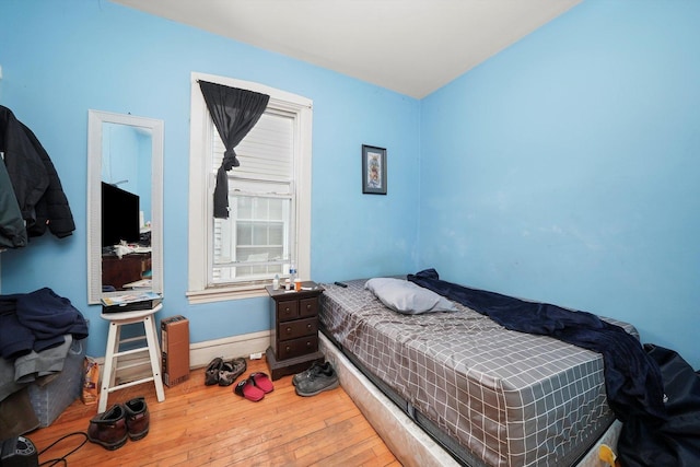 5044 W Roscoe St, Chicago, IL 60641 - bedroom with hardwood / wood-style floors and baseboards