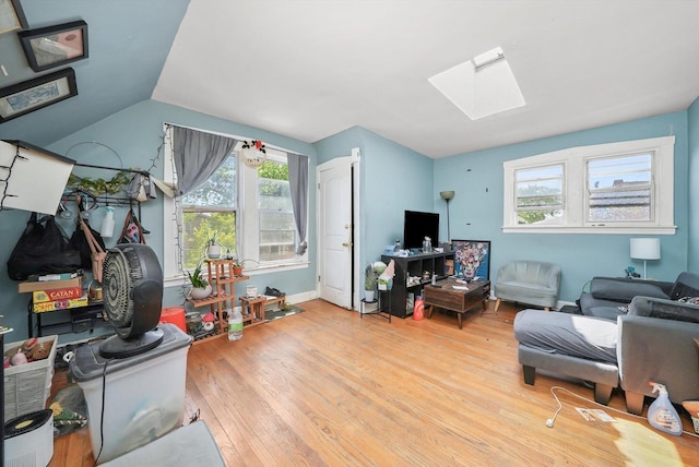 5044 W Roscoe St, Chicago, IL 60641 - living area featuring a skylight and wood finished floors