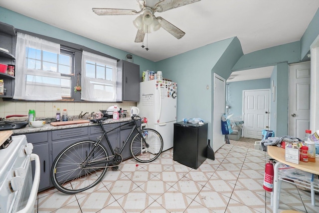 5044 W Roscoe St, Chicago, IL 60641 - kitchen featuring freestanding refrigerator, range, gray cabinets, ceiling fan, and light countertops