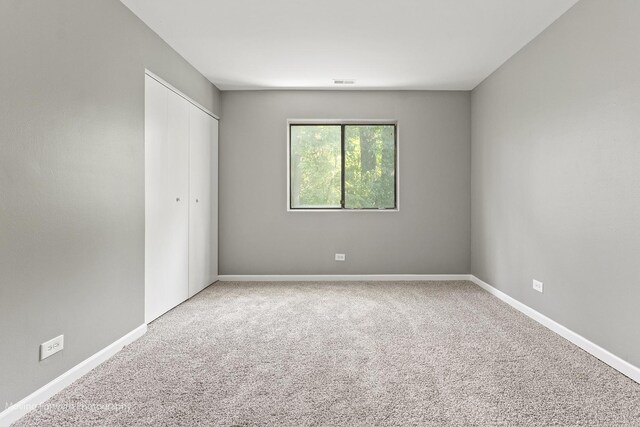 1249 Cunningham Dr Unit 2E, Calumet City, IL 60409 - unfurnished bedroom featuring carpet flooring and a closet