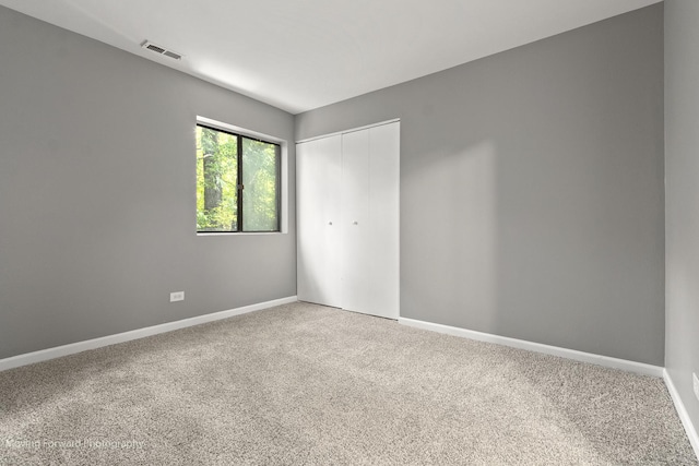 1249 Cunningham Dr Unit 2E, Calumet City, IL 60409 - unfurnished bedroom featuring carpet flooring and a closet