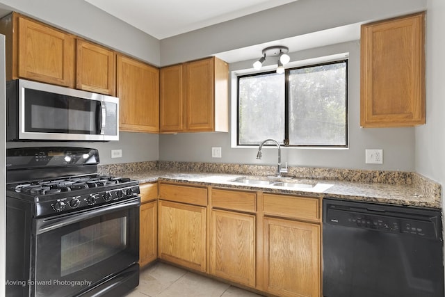 1249 Cunningham Dr Unit 2E, Calumet City, IL 60409 - kitchen with black appliances, light stone counters, and light tile patterned flooring