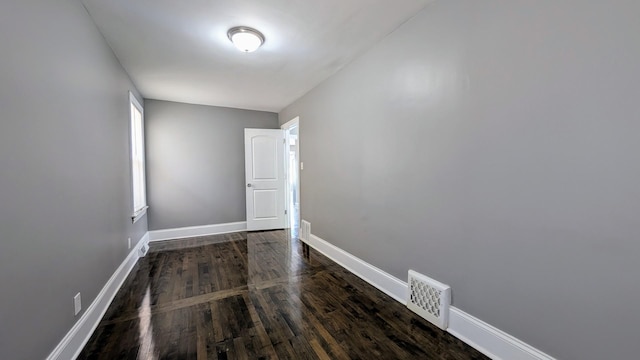 5937 W Eastwood Ave, Chicago, IL 60630 - empty room featuring baseboards and dark wood-style floors