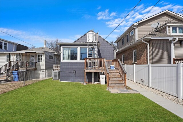 5937 W Eastwood Ave, Chicago, IL 60630 - back of house with stairway, a fenced backyard, and a deck