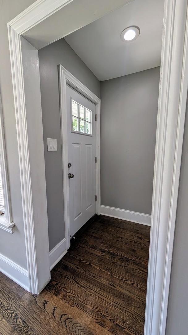 5937 W Eastwood Ave, Chicago, IL 60630 - entrance foyer featuring baseboards and dark wood-style flooring