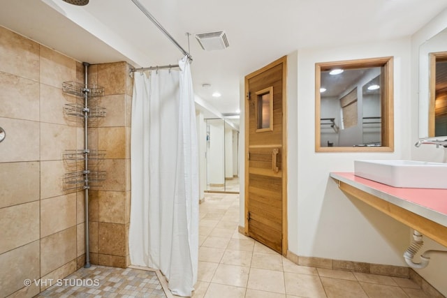 2111 Lake Ave, Wilmette, IL 60091 - bathroom featuring a tile shower, tile patterned floors, and recessed lighting