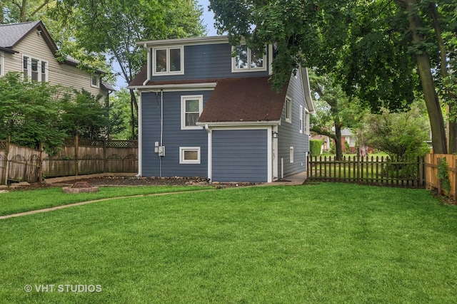 2111 Lake Ave, Wilmette, IL 60091 - back of house featuring a shingled roof and a fenced backyard