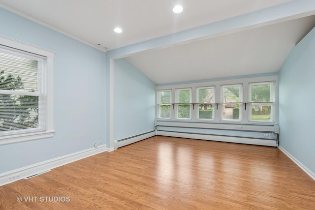 2111 Lake Ave, Wilmette, IL 60091 - spare room with lofted ceiling, light wood-type flooring, recessed lighting, and a baseboard heating unit