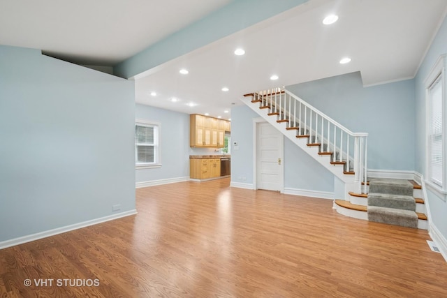 2111 Lake Ave, Wilmette, IL 60091 - unfurnished living room with stairs, light wood-style floors, and recessed lighting