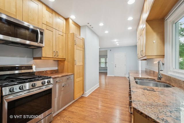 2111 Lake Ave, Wilmette, IL 60091 - kitchen with stainless steel appliances, light brown cabinets, light wood finished floors, and recessed lighting
