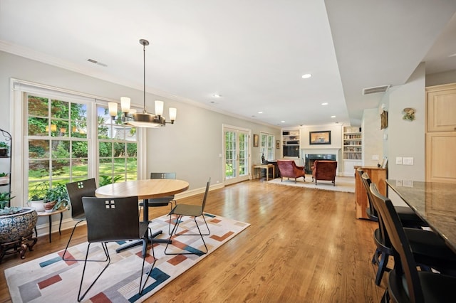 1054 Seneca Rd, Wilmette, IL 60091 - dining space featuring ornamental molding, light wood finished floors, and recessed lighting