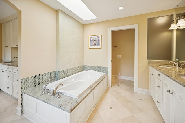 1054 Seneca Rd, Wilmette, IL 60091 - bathroom with double vanity, a bath, tile patterned floors, and recessed lighting