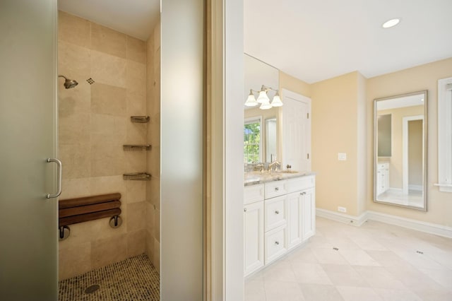 1054 Seneca Rd, Wilmette, IL 60091 - bathroom with a shower stall, double vanity, recessed lighting, and tile patterned floors