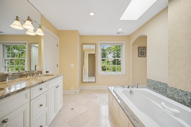 1054 Seneca Rd, Wilmette, IL 60091 - full bathroom with a skylight, vanity, healthy amount of natural light, a bath, and recessed lighting