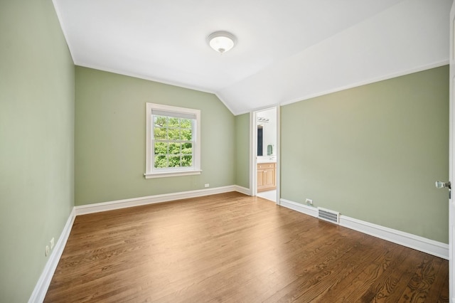 1054 Seneca Rd, Wilmette, IL 60091 - unfurnished room featuring wood finished floors and vaulted ceiling