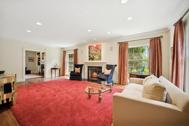 1054 Seneca Rd, Wilmette, IL 60091 - living room with a fireplace with flush hearth, crown molding, wood finished floors, and recessed lighting