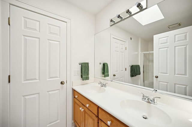 1054 Seneca Rd, Wilmette, IL 60091 - full bathroom featuring double vanity, a shower stall, and a skylight