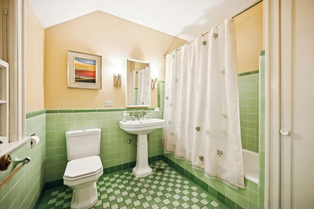1054 Seneca Rd, Wilmette, IL 60091 - full bathroom featuring tile walls, a wainscoted wall, shower / bath combo with shower curtain, and tile patterned flooring