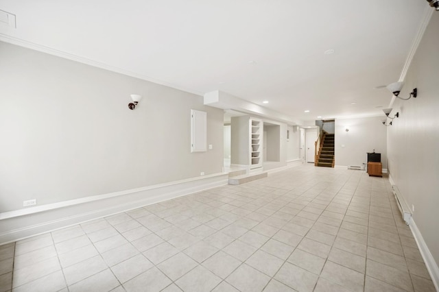 1054 Seneca Rd, Wilmette, IL 60091 - spare room featuring stairway, light tile patterned floors, crown molding, baseboard heating, and built in features