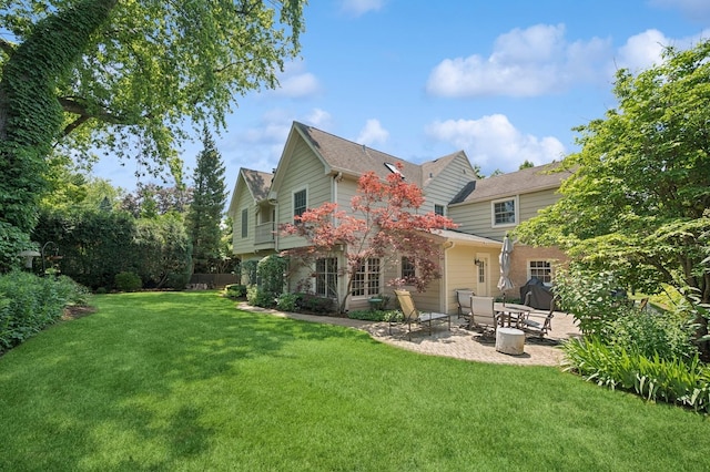 1054 Seneca Rd, Wilmette, IL 60091 - back of property featuring a patio area and a yard