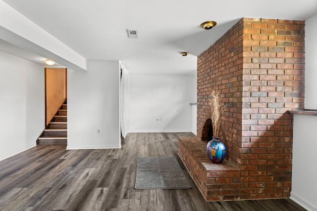 440 Charles Ct, South Elgin, IL 60177 - unfurnished living room featuring dark wood finished floors, stairs, and a fireplace