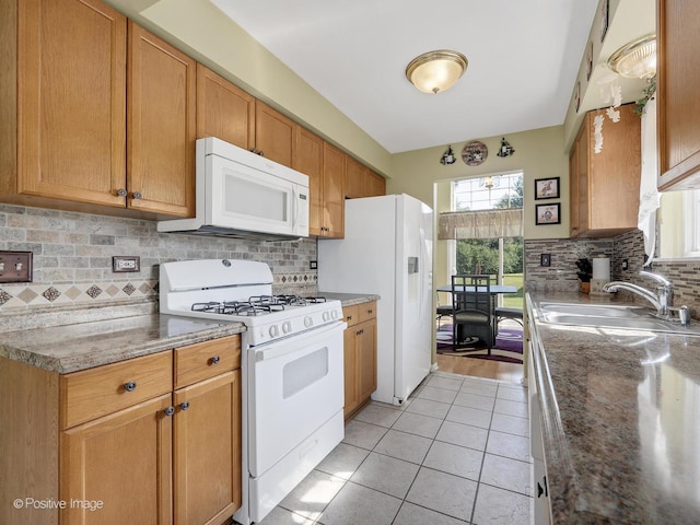 673 Kingsbridge Dr, Carol Stream, IL 60188 - kitchen featuring white appliances, decorative backsplash, and light tile patterned flooring