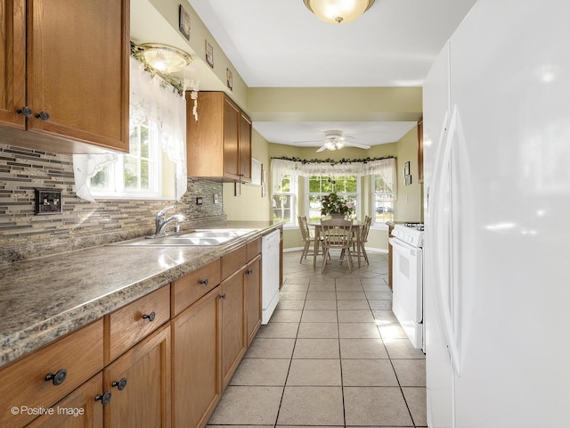 673 Kingsbridge Dr, Carol Stream, IL 60188 - kitchen featuring white appliances, tasteful backsplash, light tile patterned floors, a ceiling fan, and brown cabinets