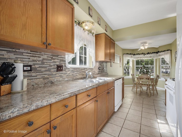 673 Kingsbridge Dr, Carol Stream, IL 60188 - kitchen featuring white appliances, decorative backsplash, light tile patterned floors, a ceiling fan, and light countertops