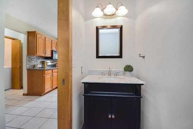708 Wheeler Dr, Hudson, IL 61748 - bathroom with vanity, decorative backsplash, a chandelier, and tile patterned floors