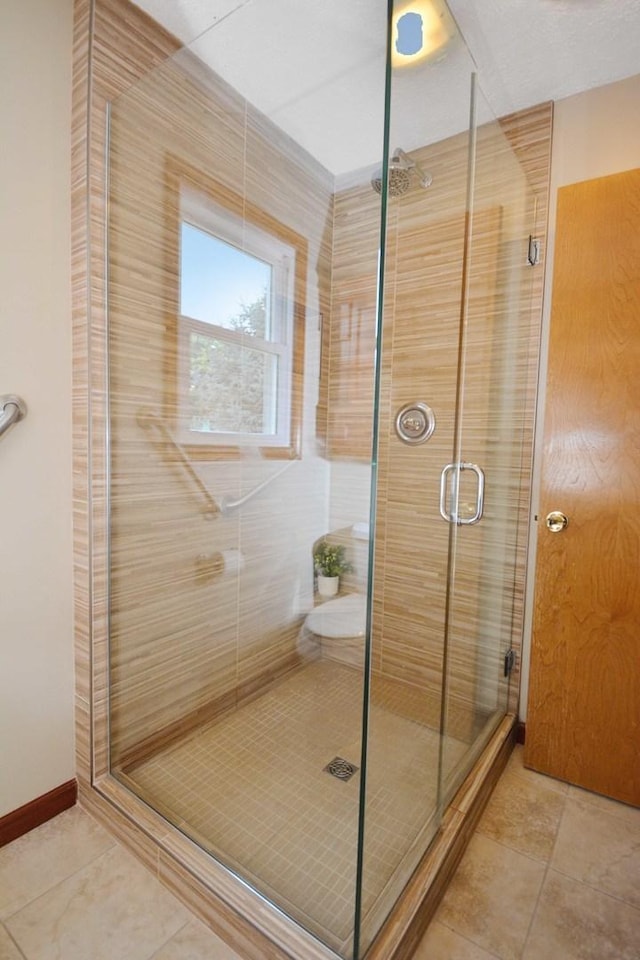708 Wheeler Dr, Hudson, IL 61748 - bathroom featuring a shower stall and tile patterned flooring